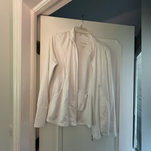 Unprotective white zip up